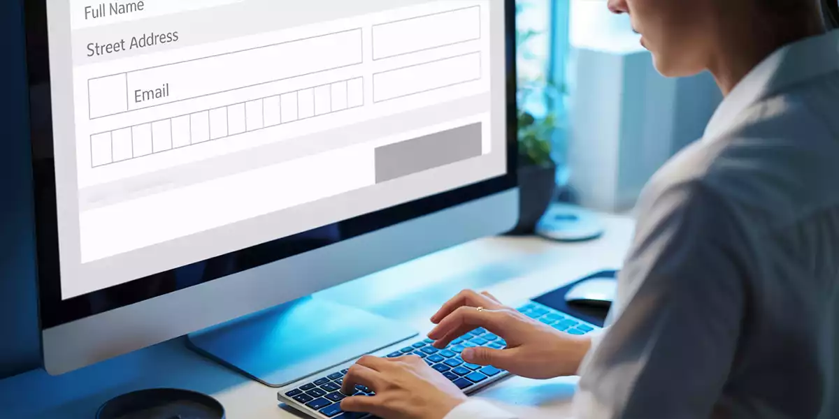 A user entering information into an on-screen form