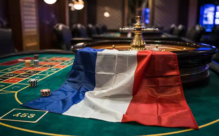 French flag and a roulette table