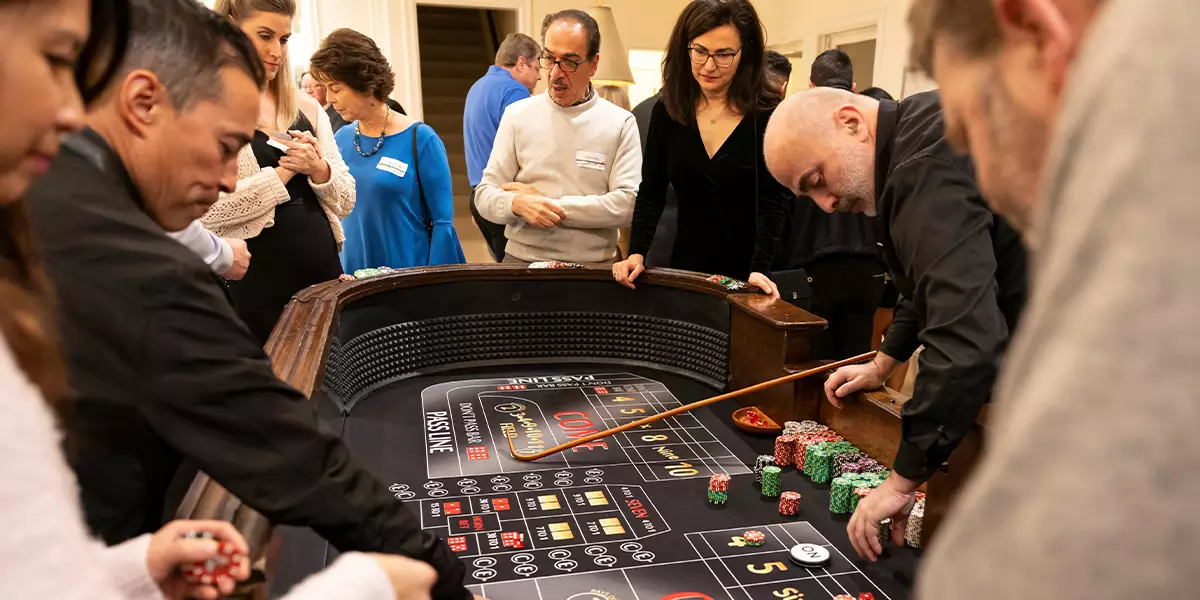 Players-gathered-around-a-gaming-table-in-a-physical-casino