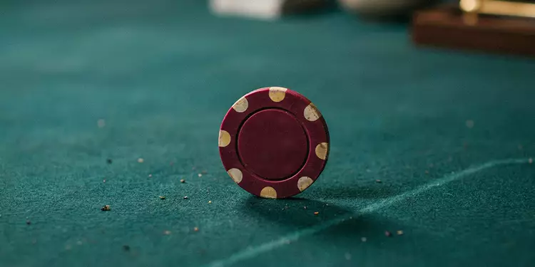 a-single-casino-chip-on-a-table