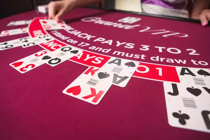 blackjack cards in a table