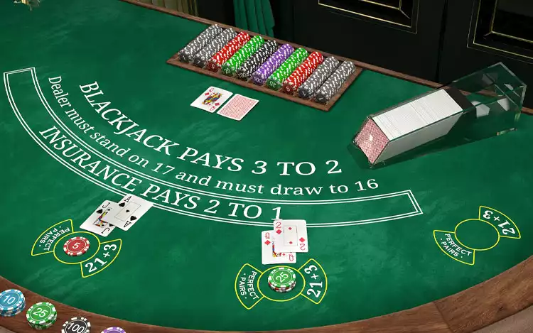 chips and cards on a blackjack table