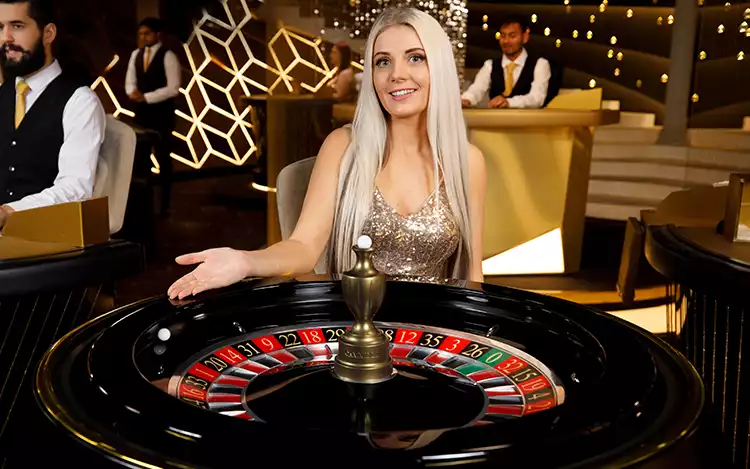 blonde female live roulette dealer