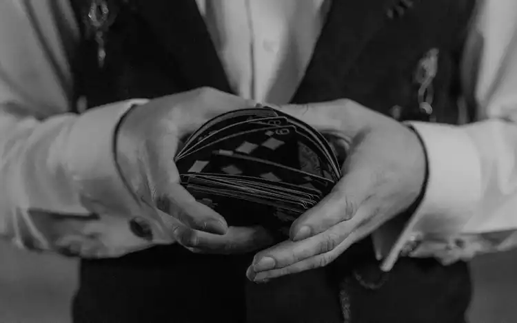 man shuffling cards