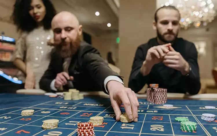 casino players playing french roulette