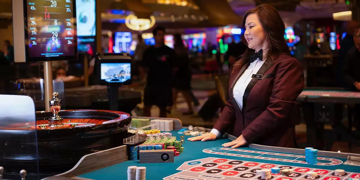 casino table dealer of roulette game