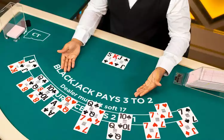 a man dealing cards during a blackjack table game