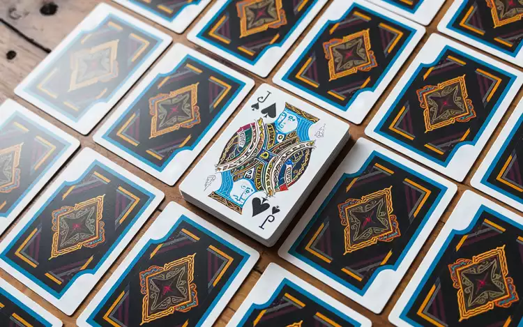 jack of spades on top of card deck