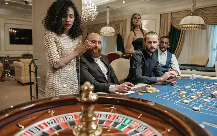 french roulette table and players