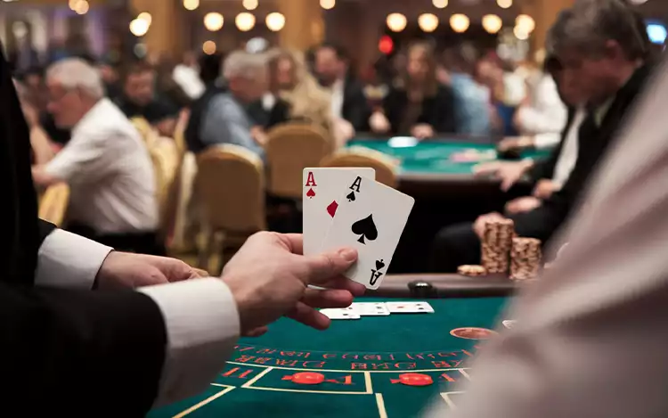 player being dealt cards at a blackjack table