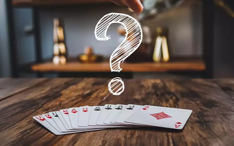 question mark above a deck of cards