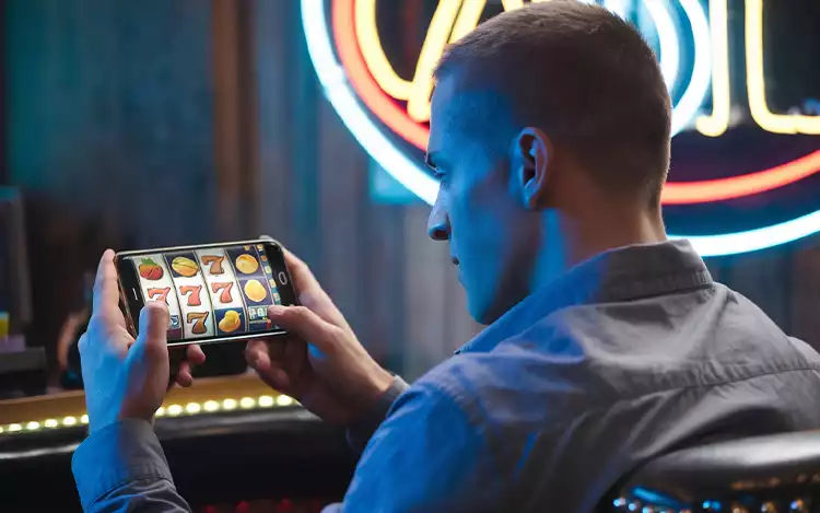 person playing a slot game