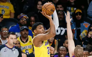 Lakers player taking a jumpshot