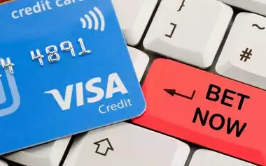 VISA Betting showing a visa credit card on a keyboard