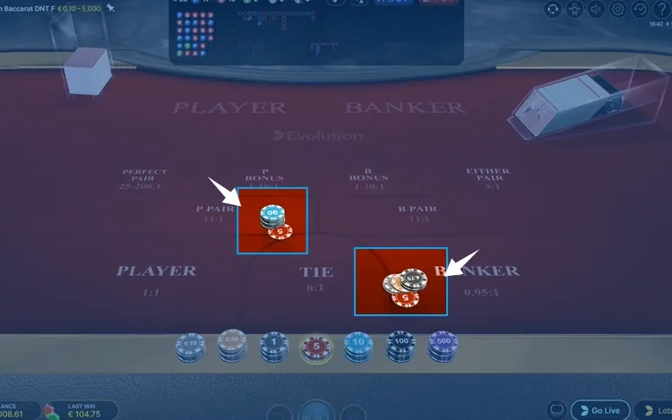 collecting winnings from a baccarat table