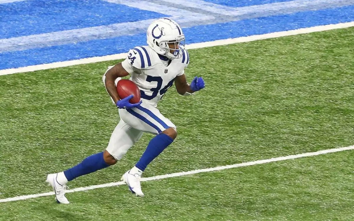 Indianapolis Colts cornerback Isaiah Rodgers carries the ball