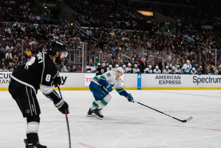Vancouver Canucks player blocking a pass