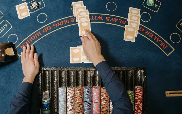 Why Blackjack Dealers Tap the Table