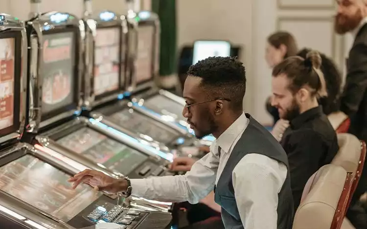 a group of people playing video games in a room.