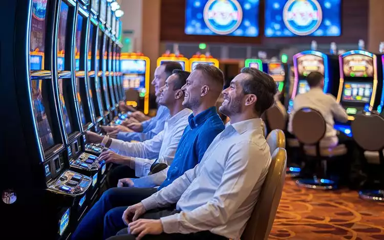 casino players engaged in slots