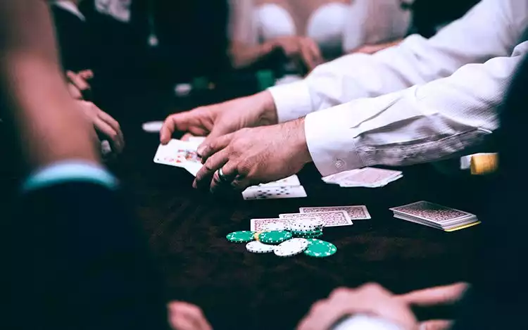 a person playing a game of cards on a table