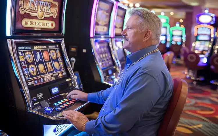 man playing with different symbols in slot machine