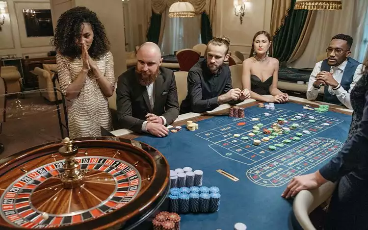 a man and woman playing a game of roulette