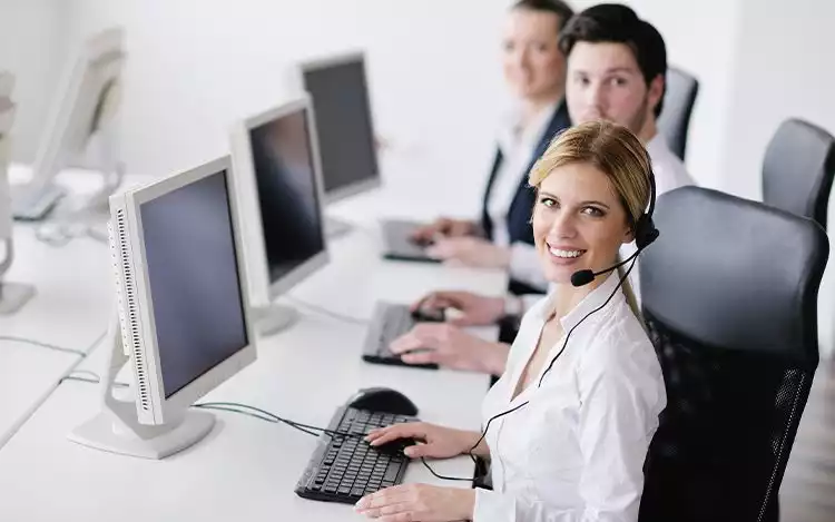 a row of contact support team personnel