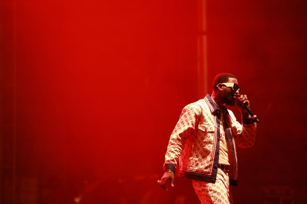 Shot of rapper Gucci Mane performing wearing Gucci clothing