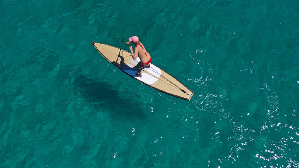 Person paddleboarding in the sea