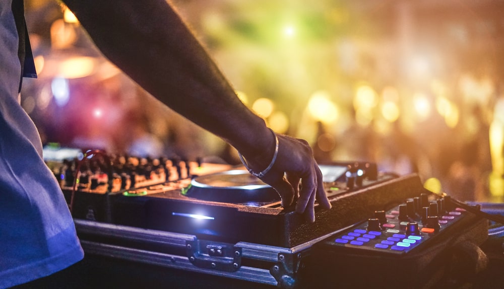 Close-up of a DJ playing their set at a party