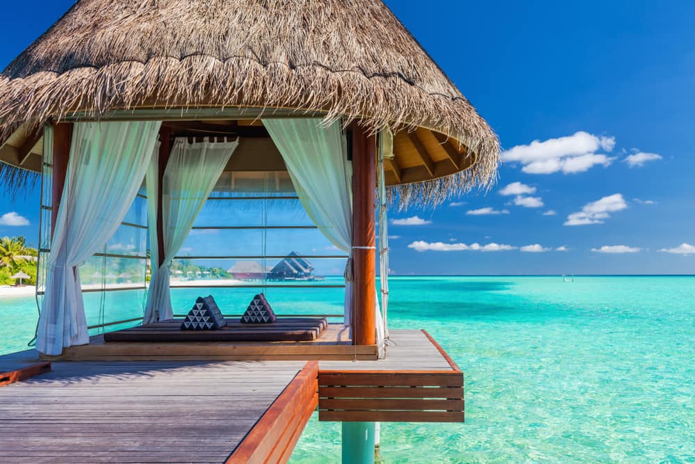 Luxury spa hut on a jetty overlooking the blue lagoon