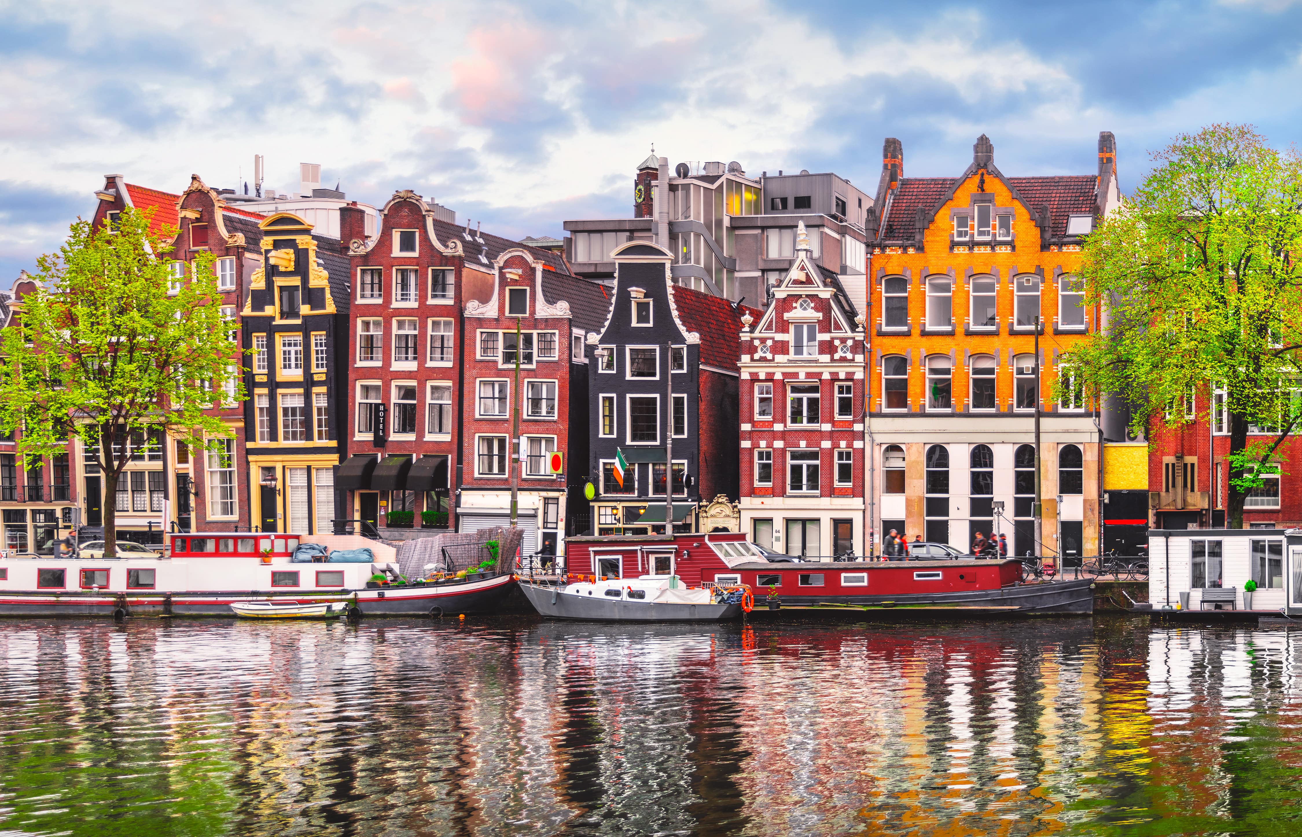 Picture of classic colourful Dutch houses and houseboats on the river Amstel