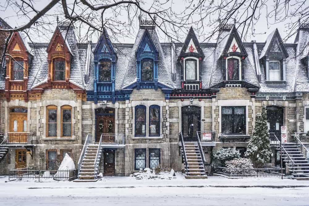 View on Carré Saint Louis colourful Victorian houses on a snowy day