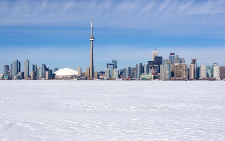 Toronto’s skyline on a clear winter’s day with fresh snow covering the ground.