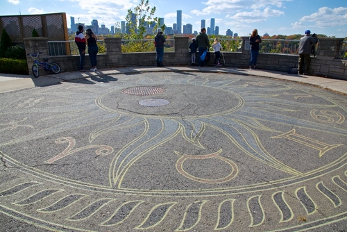 A view of the Chester Hill Lookout astrology mosaic in Toronto. People can be seen in the background enjoying the view.